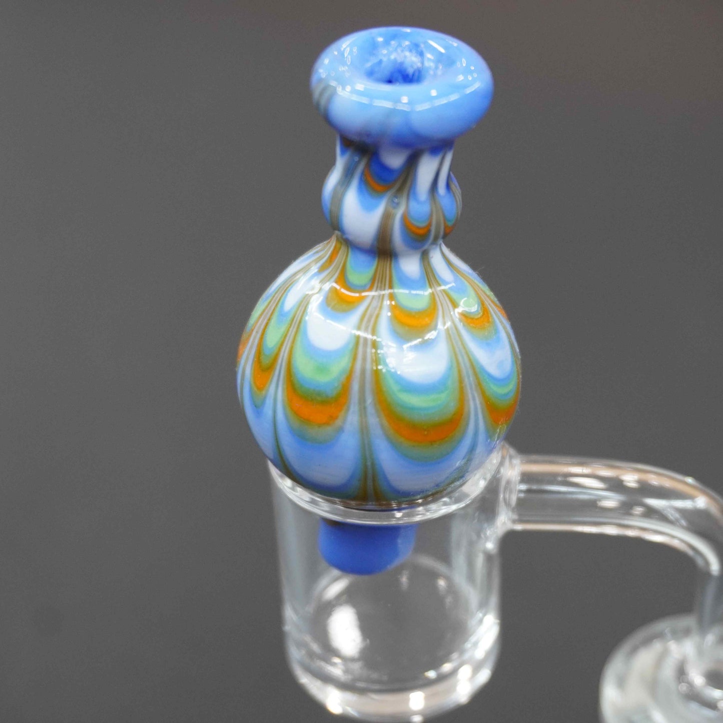 Raked bubble carb cap