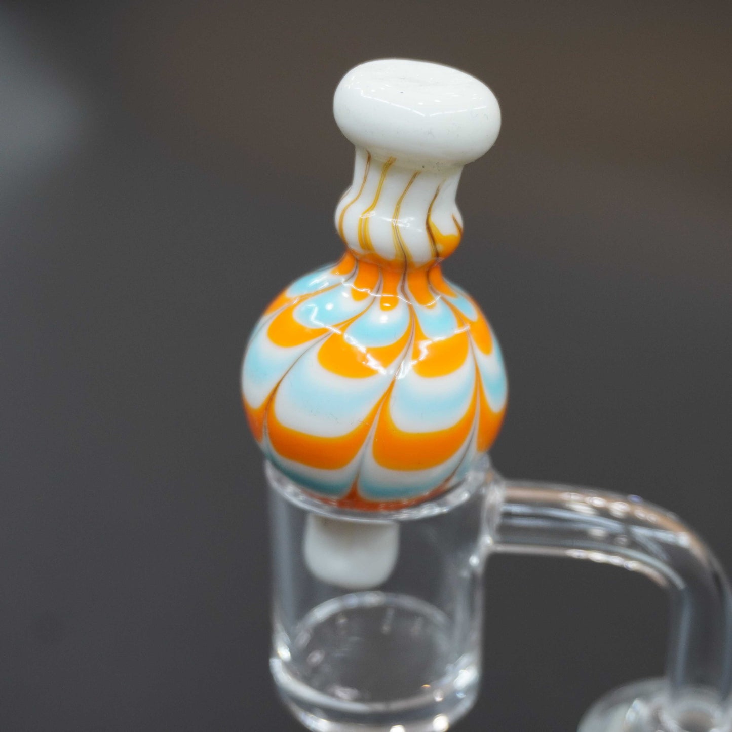 Raked bubble carb cap