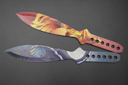 Two decorative knives with artistic handles on a dark background