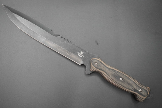 Knife with a wooden handle on a gray background