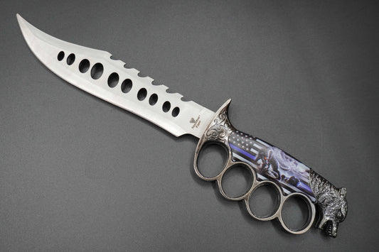 Decorative knife with knuckle duster handle on a gray background