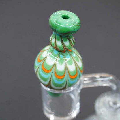 Raked bubble carb cap