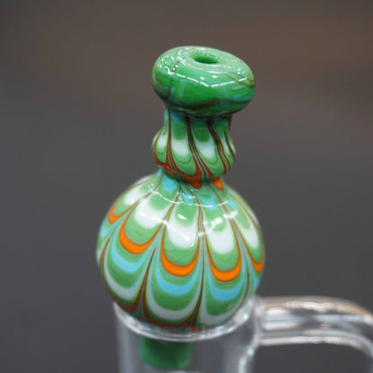 Raked bubble carb cap