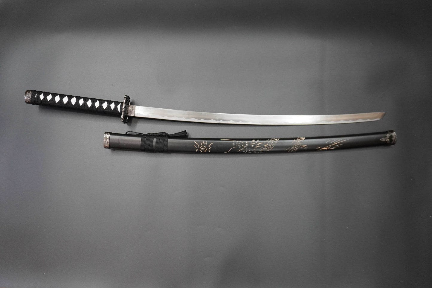 Sword and sheath on a gray background
