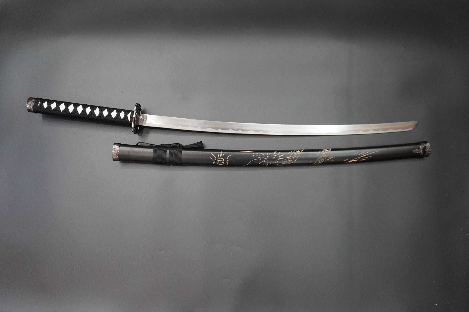 Sword and sheath on a gray background