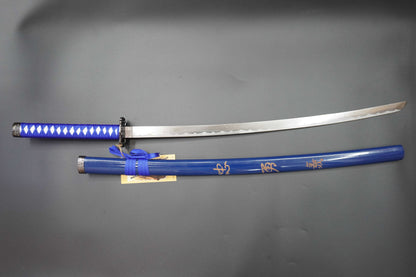 Sword with blue sheath on a gray background