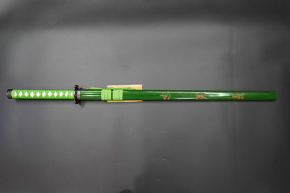 Green sword with decorative patterns on a gray background