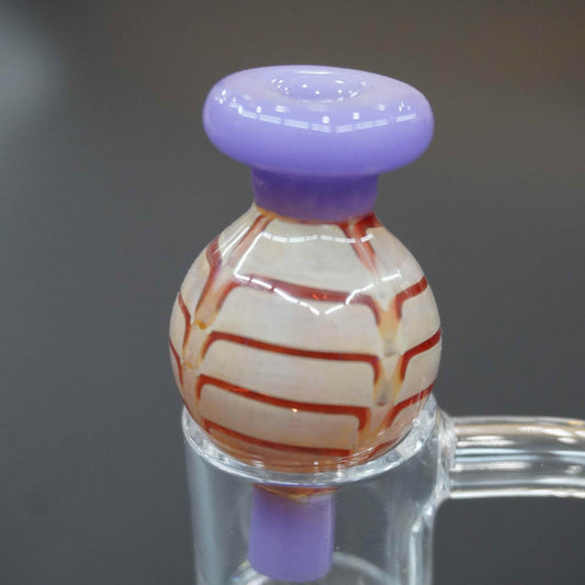Raked bubble carb cap