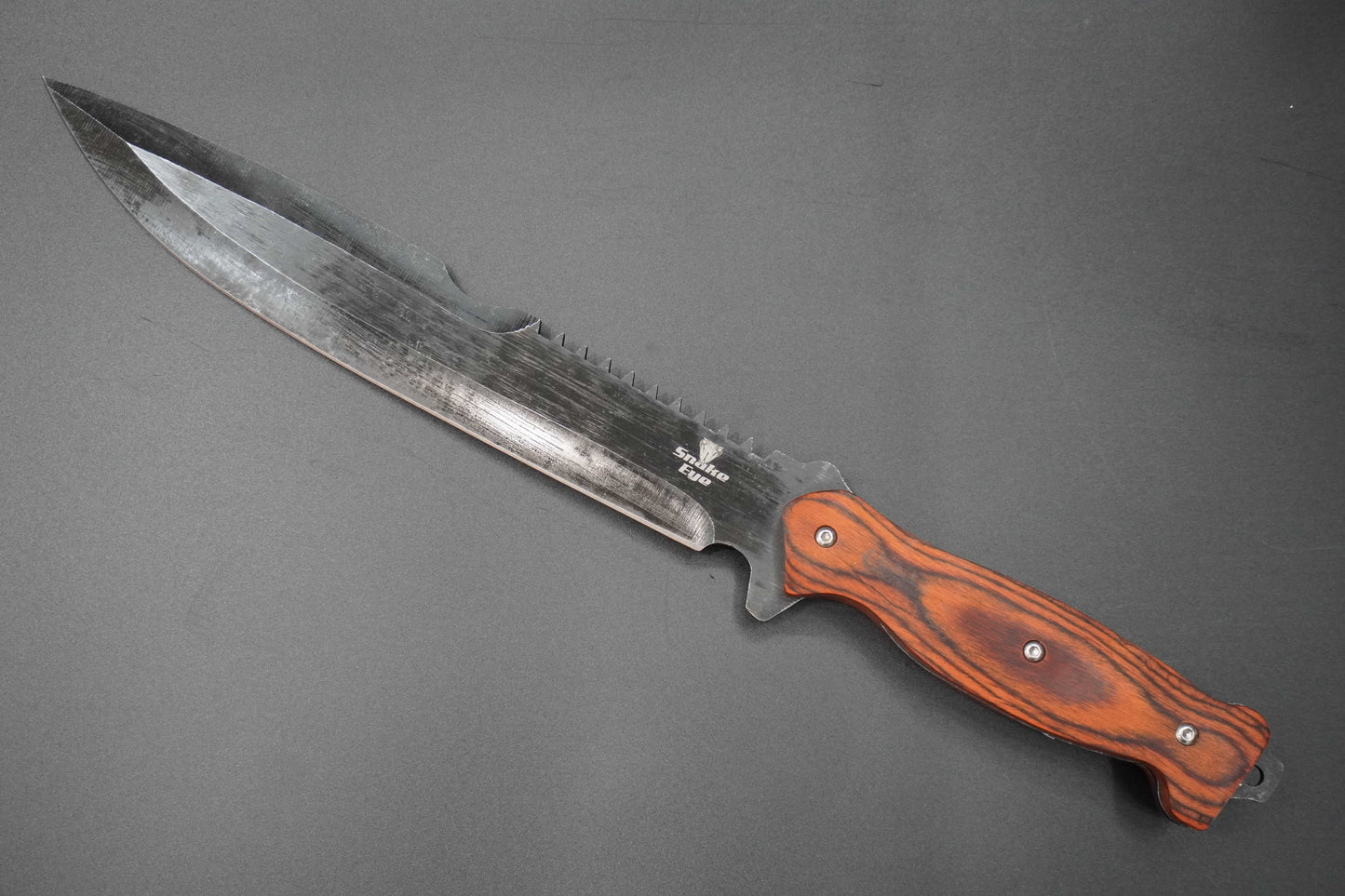 Knife with a wooden handle on a gray background
