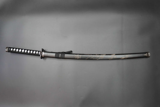Sword with decorative blade on a gray background