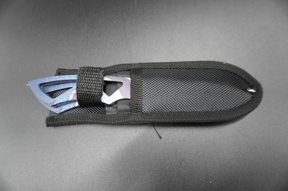 Black tool with metal components on a gray background