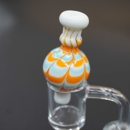 Raked bubble carb cap